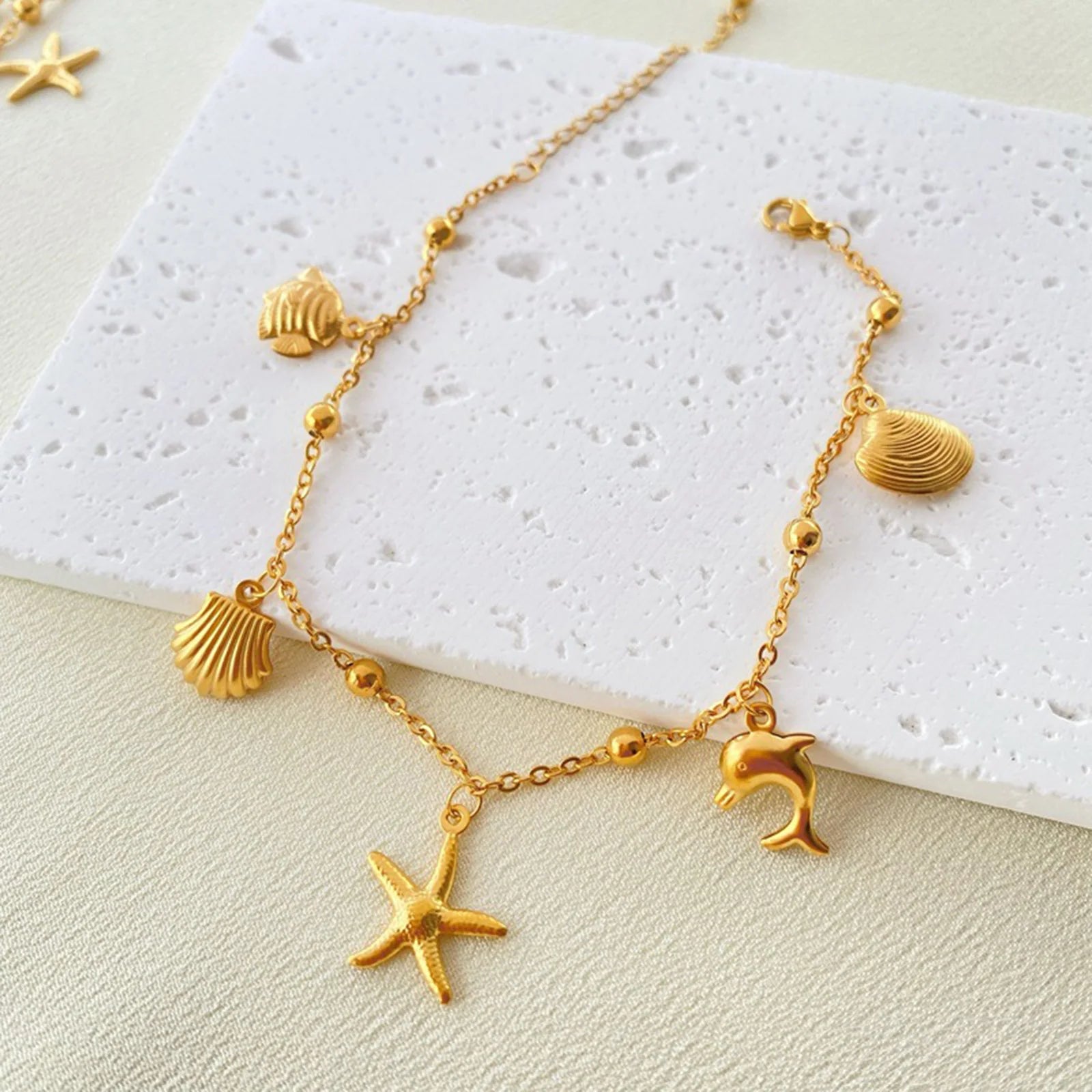 Gold Tone Stainless Steel Summer Ocean Theme Anklet - Dolphins, Starfish, Shell
