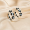 Blackened 925 Sterling Silver Blue CZ Flower Hoop Earrings